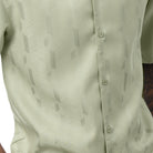 Close-up of the mint walking shirt showing the subtle vertical textured pattern and premium fabric quality.