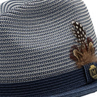 Side view navy and white braided fedora hat with feather accent
