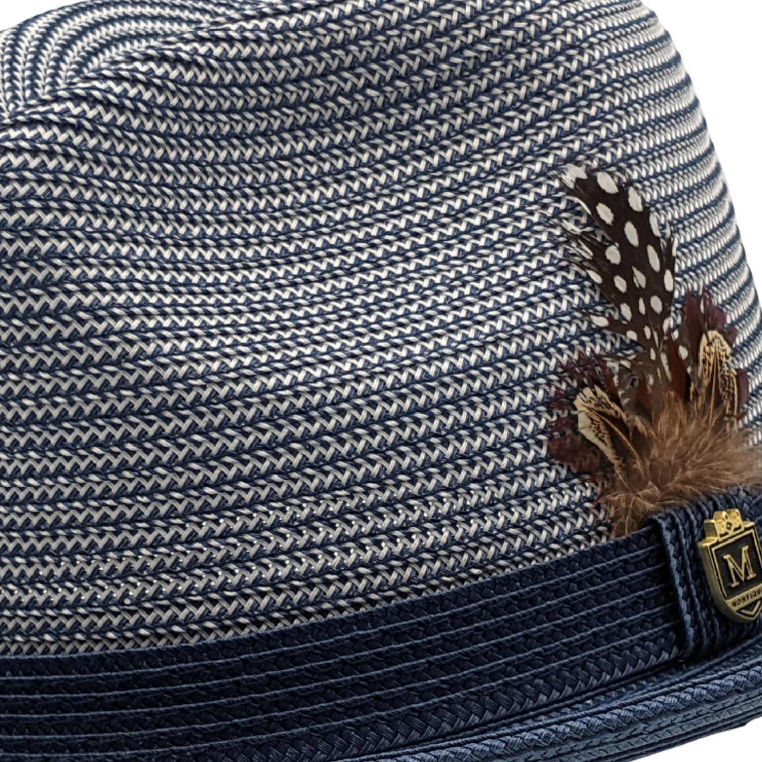Side view navy and white braided fedora hat with feather accent