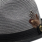 Side view black and white braided fedora hat with feather accent.