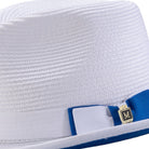 Close-up side profile of the Dazzluxe Collection white and cobalt fedora showing the wide brim and pinch crown.