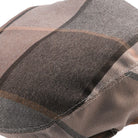 brown checkered flat cap pattern close up