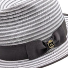 Grey Montique fedora close-up showing woven striped crown, dark grey grosgrain bow, logo pin, and matching brim trim