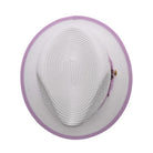 White and lavender Montique fedora hat top view showing white woven crown, lavender brim edge, and side feather detail