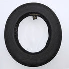 Black and white Montique fedora hat interior view with black woven brim, black sweatband, white crown, and branded label