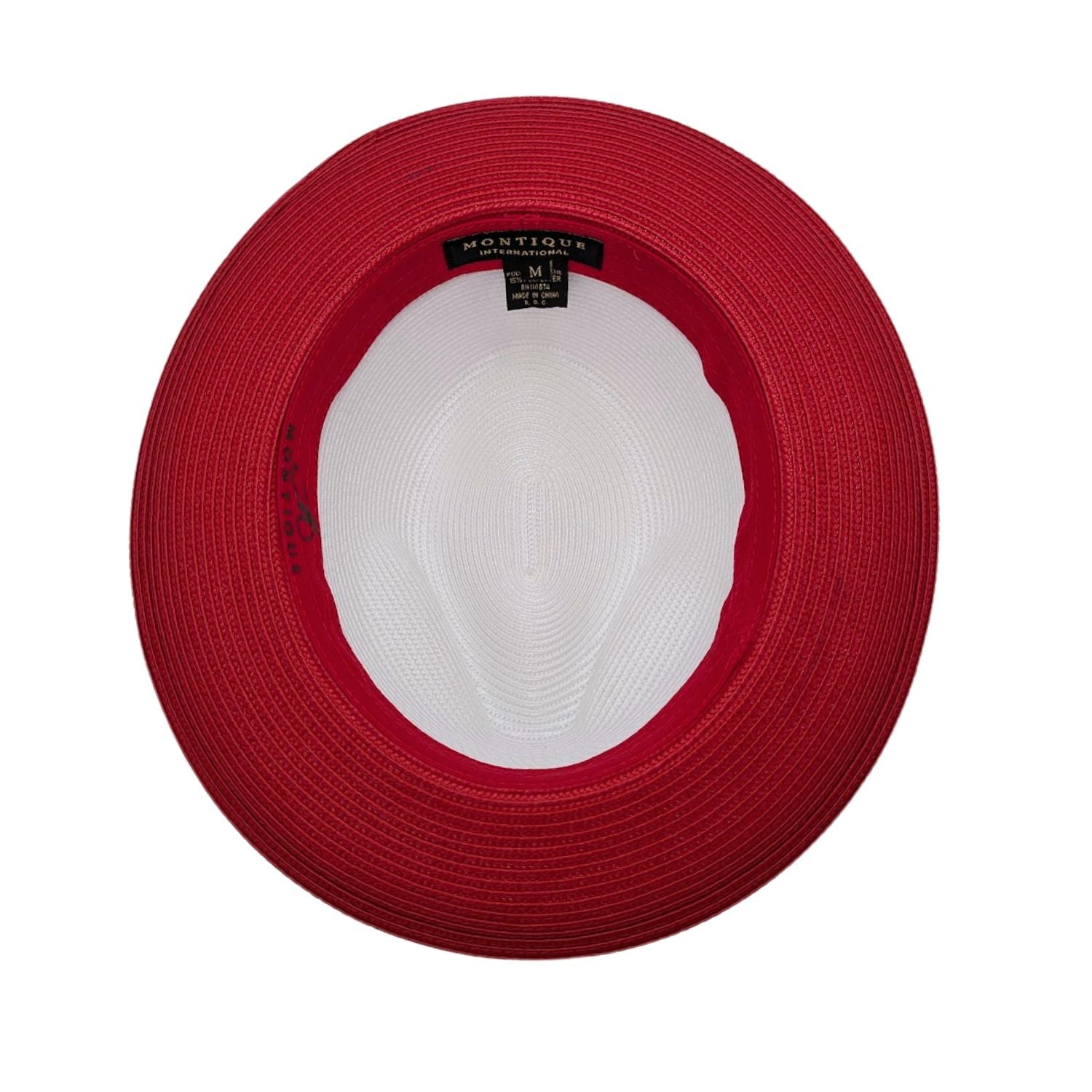 Red and white Montique fedora hat interior view showing red woven brim, white crown, sweatband, and branded label