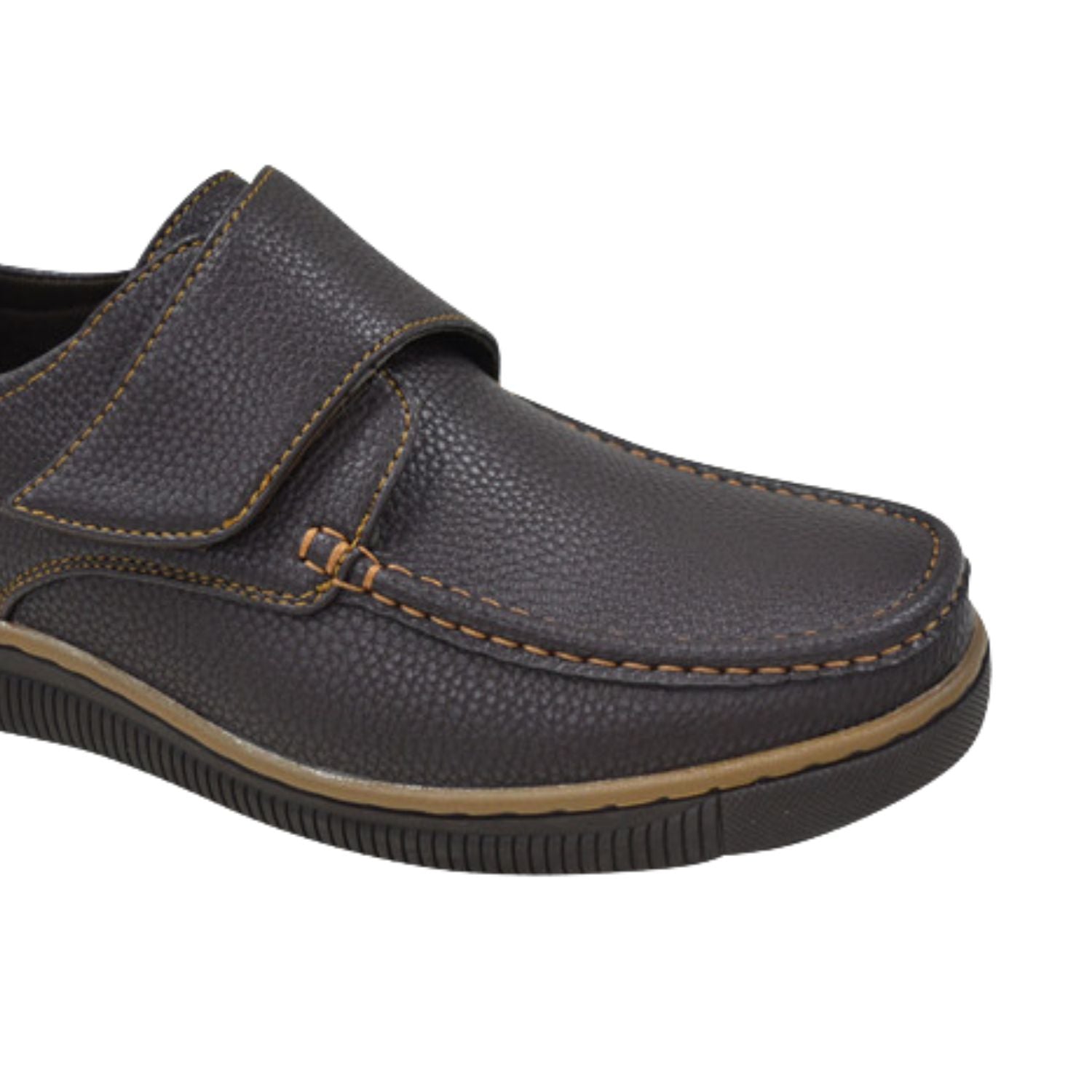 Close-up of brown men’s hook and loop casual shoe , tan stitching, and  rubber sole