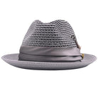 Grey Montique fedora hat front view with feather accent, satin ribbon band, logo pin, and open weave crown