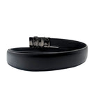 Black leather holeless ratchet belt shown coiled