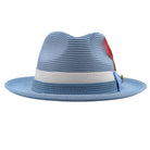 Montique Carolina blue straw fedora hat front view with light blue bow, white ribbon band, feather accent, and logo pin