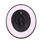 Black and white Montique fedora hat interior view with black crown, white brim underside, black edge trim, and branded sweatband