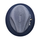 Navy Montique fedora hat top view with navy and white woven crown, solid navy brim, and side logo pin detail