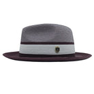 Wine and white Montique fedora hat side view with white center band, wine trim, woven crown, and logo pin