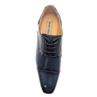 Top view of men's navy cap-toe lace-up dress shoe with polished finish