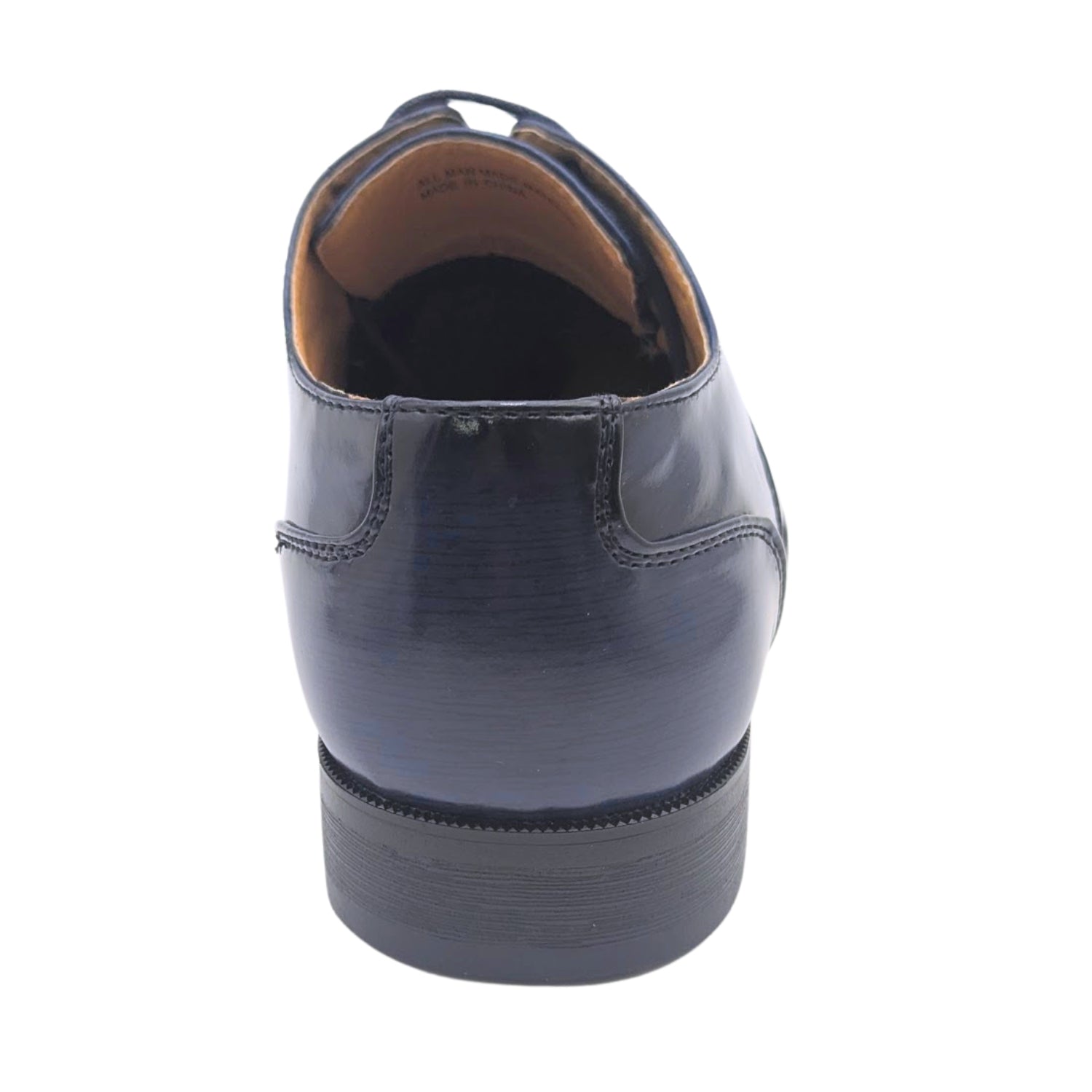 Rear view of men's navy cap-toe lace-up dress shoe with low stacked heel