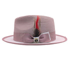 Blush and white Montique fedora hat side view with blush bow band, white brim, feather accent, and Montique pin