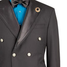 Close-up detail of black satin peak lapel blazer showing buttons and luxury fabric