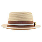 Beige Montique pork pie straw hat front view with brown ribbon band, white braided trim, and logo pin