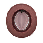 Blush and burgundy Montique fedora hat interior view with woven straw texture, contrast brim, and inside label