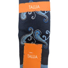close up of navy blue paisley scroll dress sock pattern