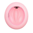 Montique pink straw fedora hat inside view showing woven construction, wide brim, inner band, and brand label
