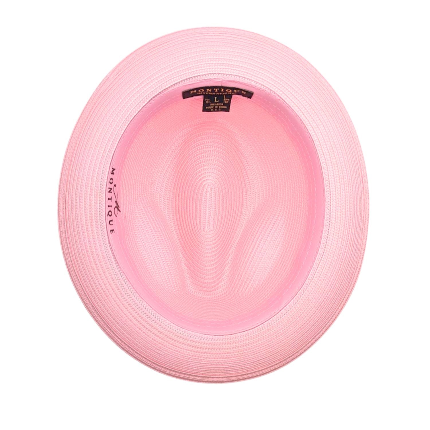 Montique pink straw fedora hat inside view showing woven construction, wide brim, inner band, and brand label
