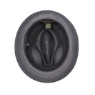 Black fedora hat interior view with woven straw texture, black sweatband, and branded size label