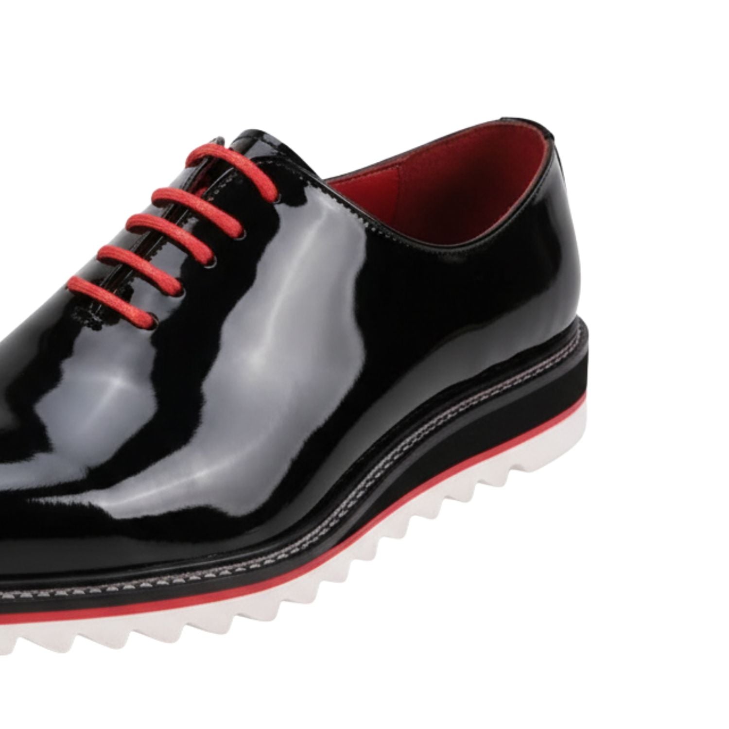 close up of black patent plain toe lace-up leather dress shoes