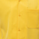 Close-up of canary solid walking suit shirt showing the open collar and clean button-front design.