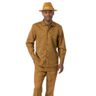 Model wearing the mustard Montique 2684 long sleeve walking suit with matching pants