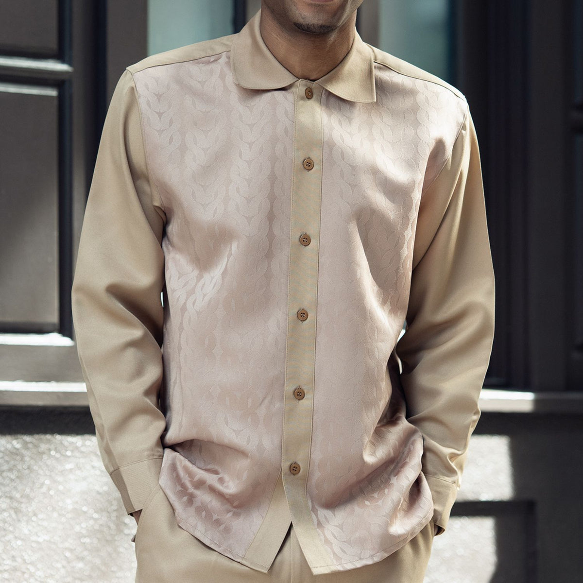 Close-up of the tan Montique 2684 shirt showing its tone-on-tone pattern, rounded collar and button front