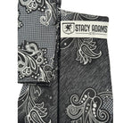 Close-up of the layered black, white, and charcoal "Cipher" paisley pattern from the Crimson Cipher Collection.