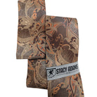 folded copper brown paisley necktie with matching pocket square