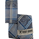 folded light blue and navy plaid paisley necktie with matching pocket square