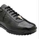 Close side view of black alligator leather sneaker