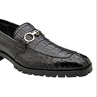 Angled view of black exotic leather bit loafer
