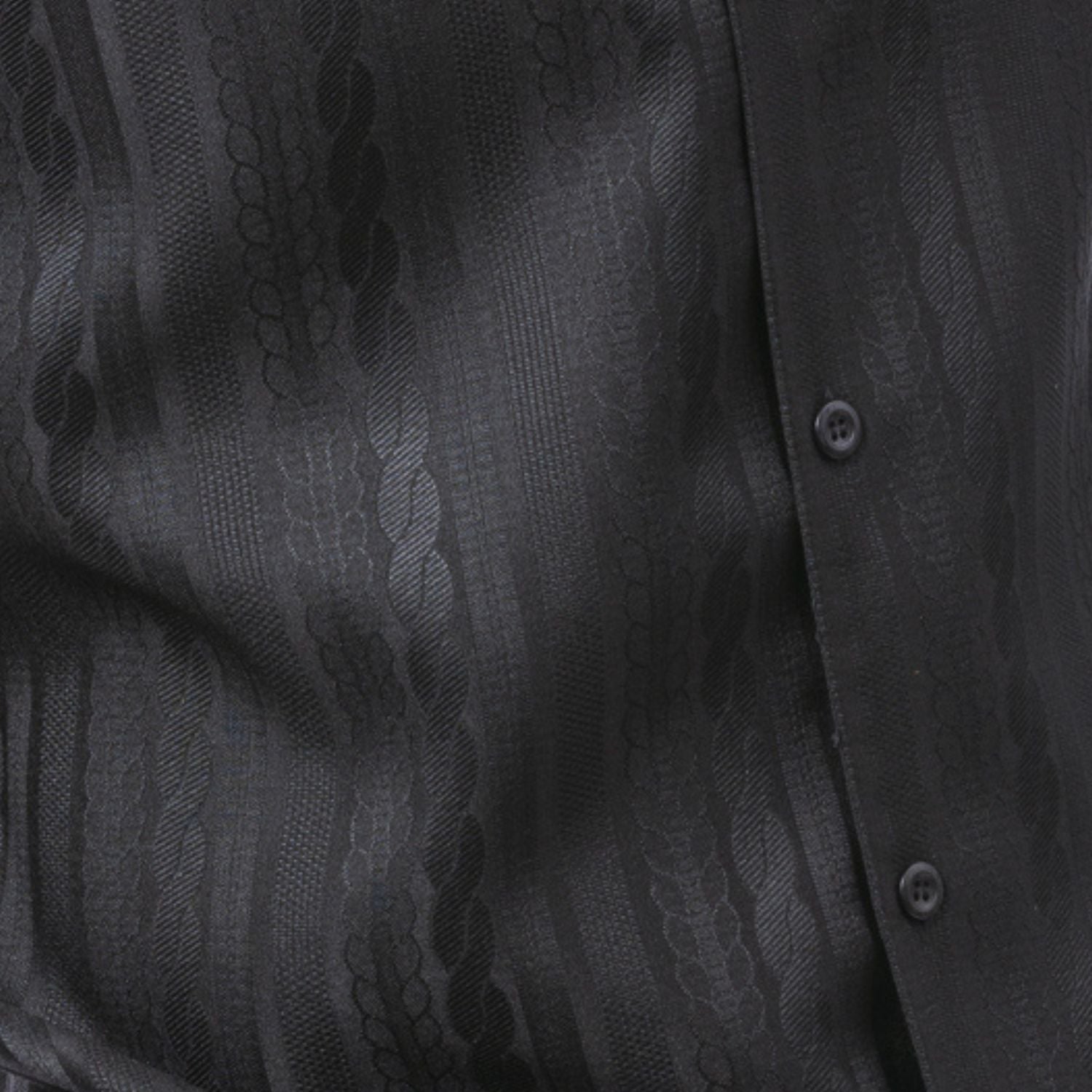Close-up of black walking suit shirt showing the detailed tone-on-tone cable knit texture.