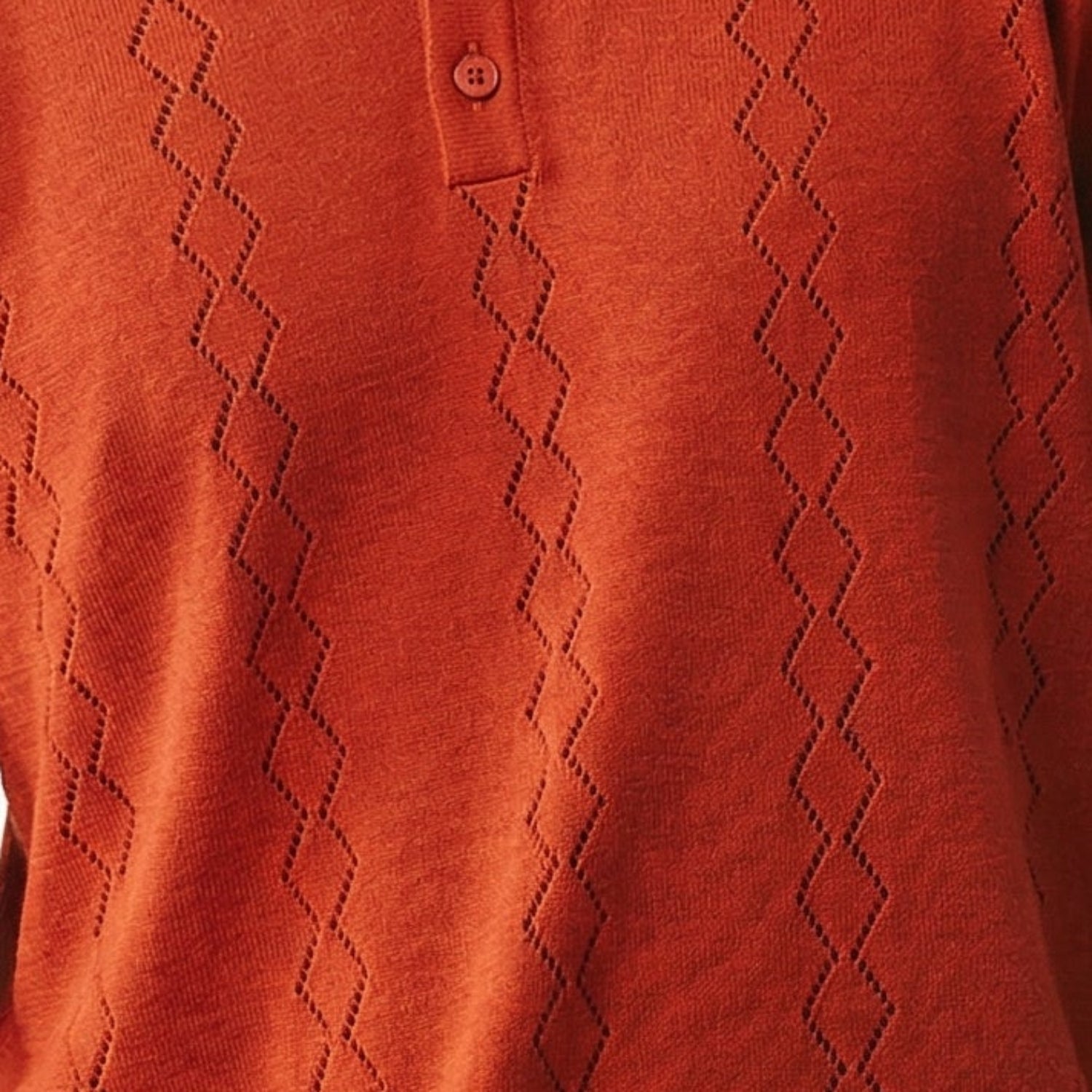 persimmon red short sleeve woven knit polo with vertical textured pattern fabric details