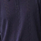 navy short sleeve woven knit polo with vertical textured pattern fabric details