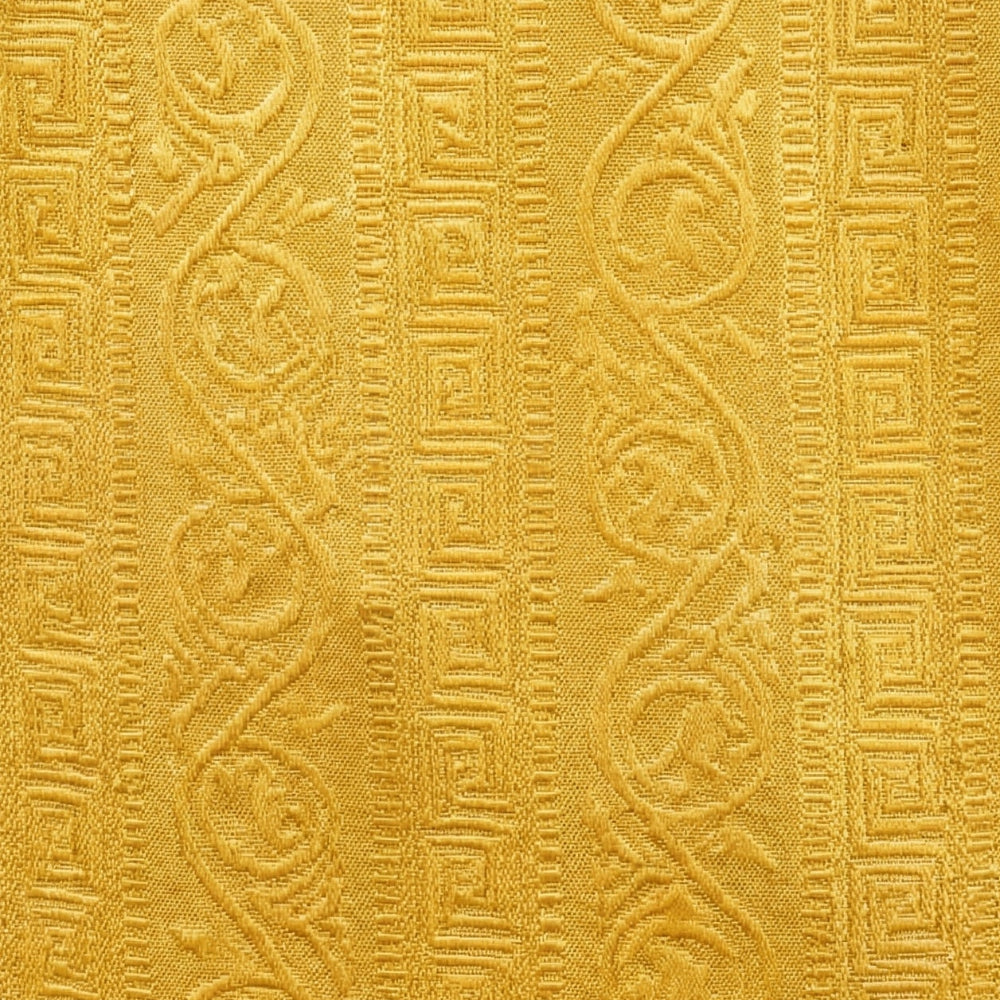 Close-up of textured yellow fabric with intricate patterns