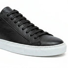 black leather sneaker lace up close up texture
