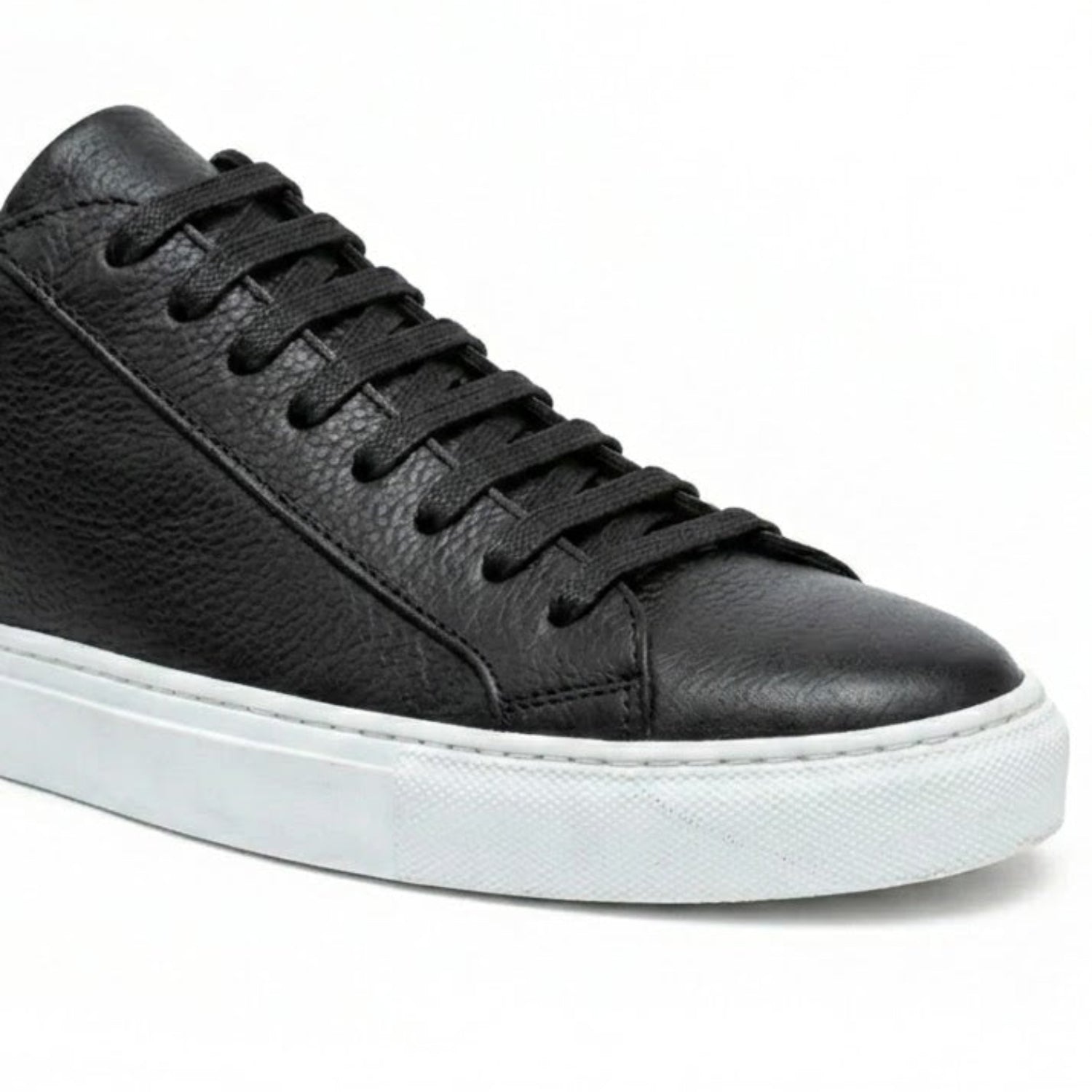 black leather sneaker lace up close up texture