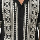 Close-up of black embroidered short sleeve walking suit shirt by Stacy Adams