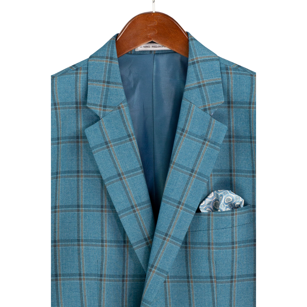 Close-up of the teal windowpane plaid jacket on a hanger, showing notch lapels, chest pocket and lining.