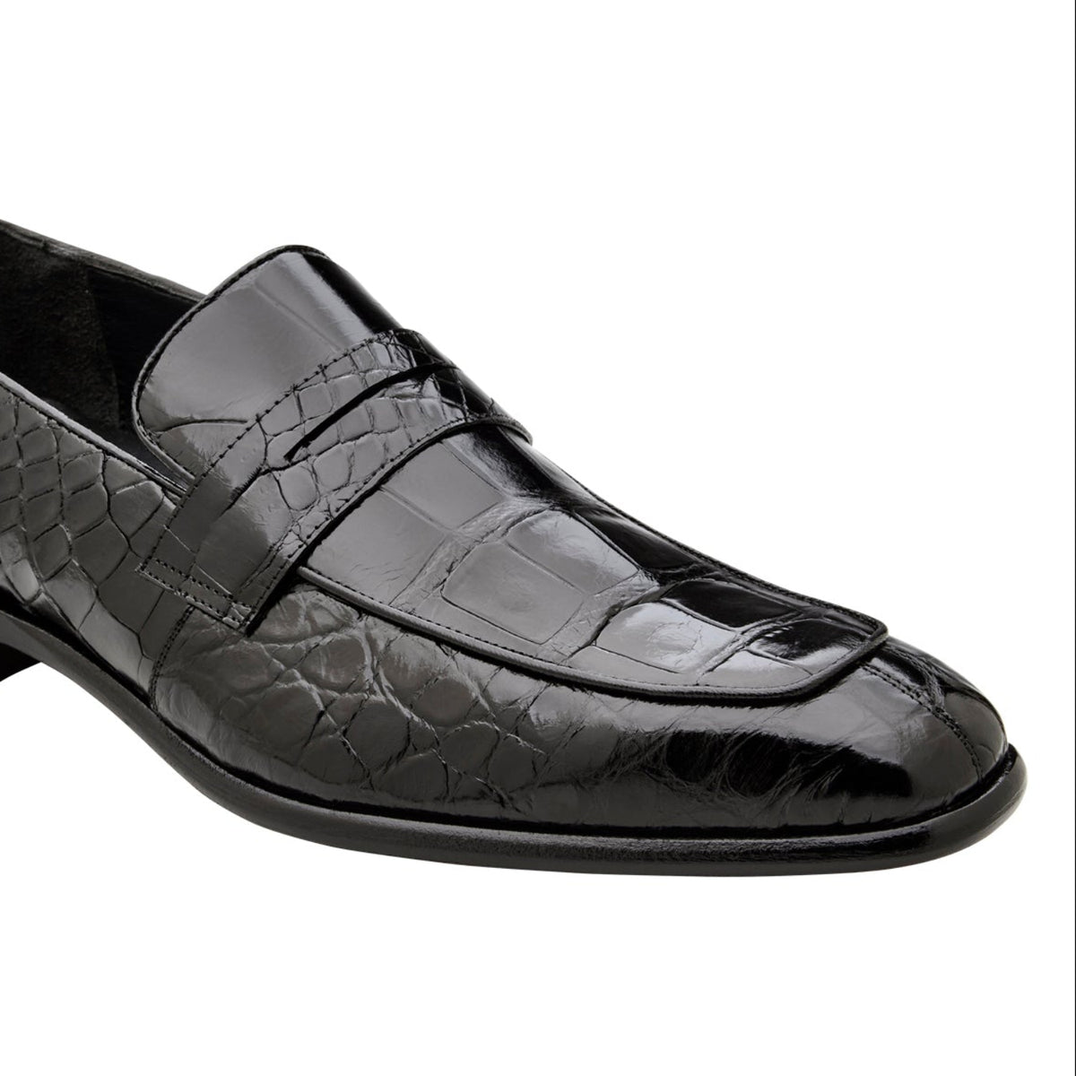 Angled view of black alligator penny loafer