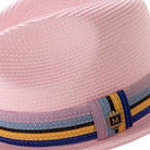 Close up profile of the pink braided straw fedora hat with multistripe ribbon band