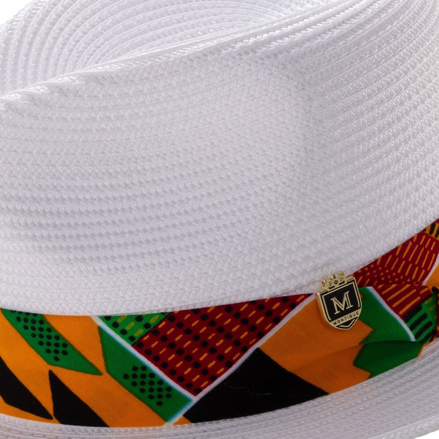 Close up view of white braided straw fedora hat with african kente print band