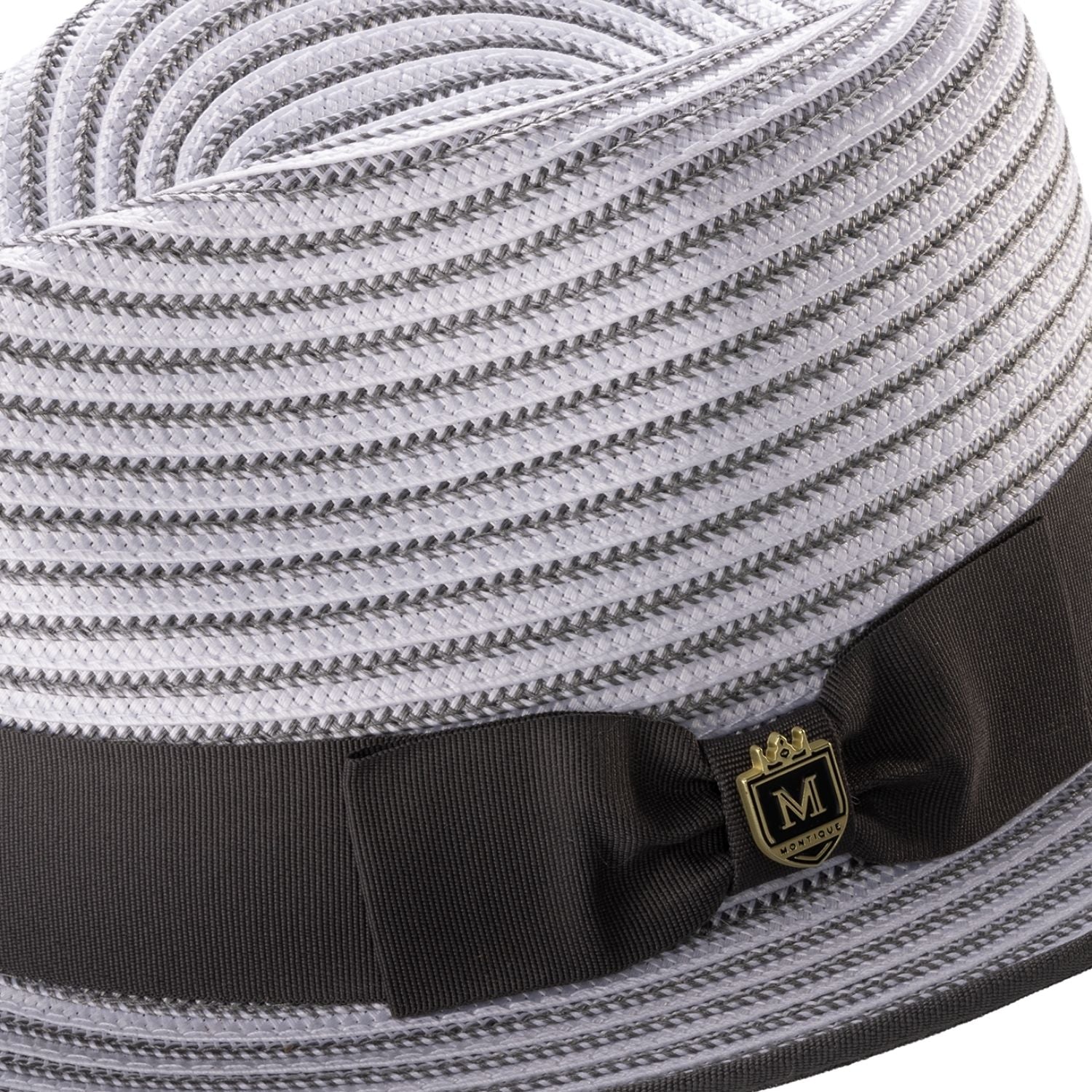 Close-up of the grey striped fabric texture and the signature Montique metal pin on the ribbon band.