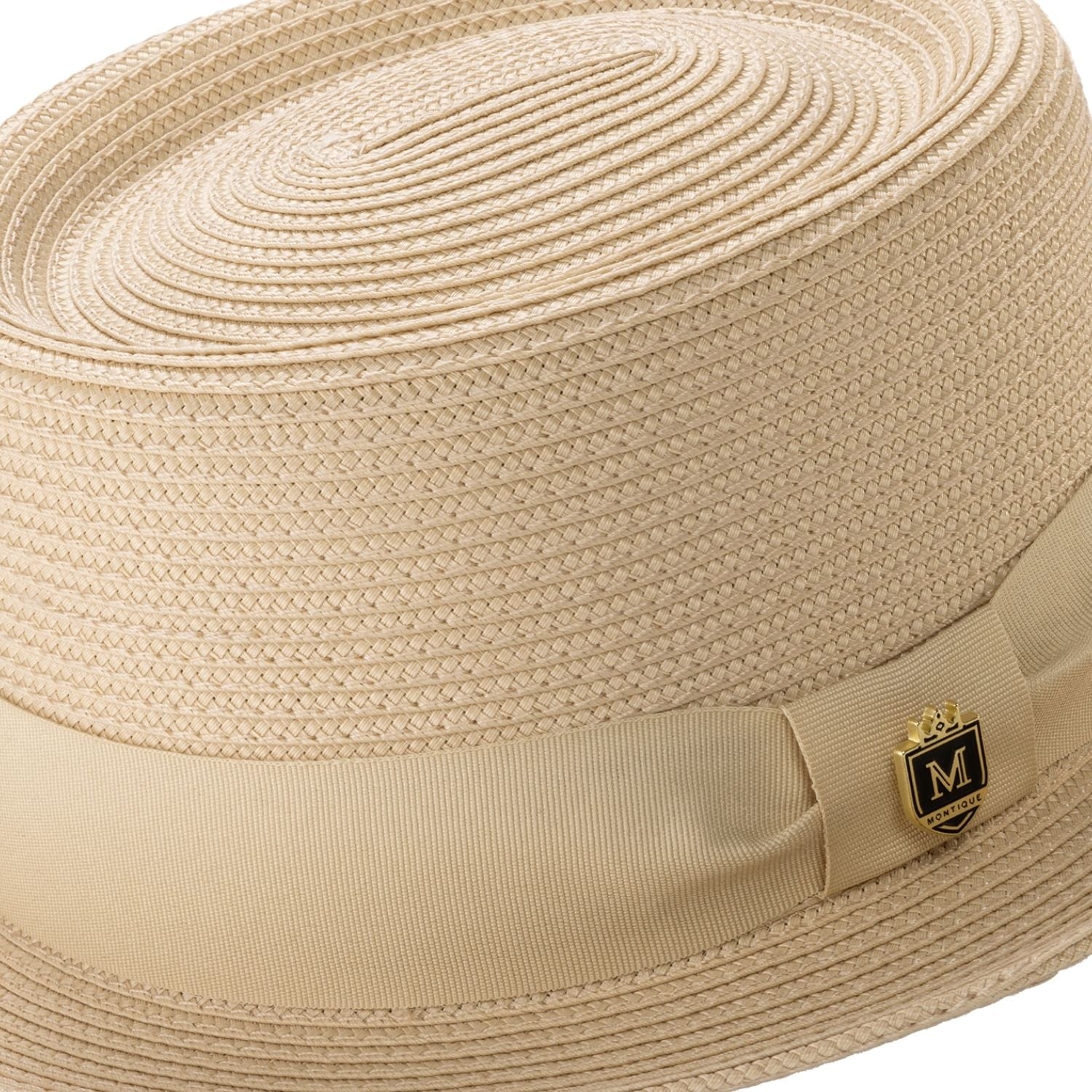 Close-up profile of the Montique Protostar beige pork pie hat showing the structured short-brim design.