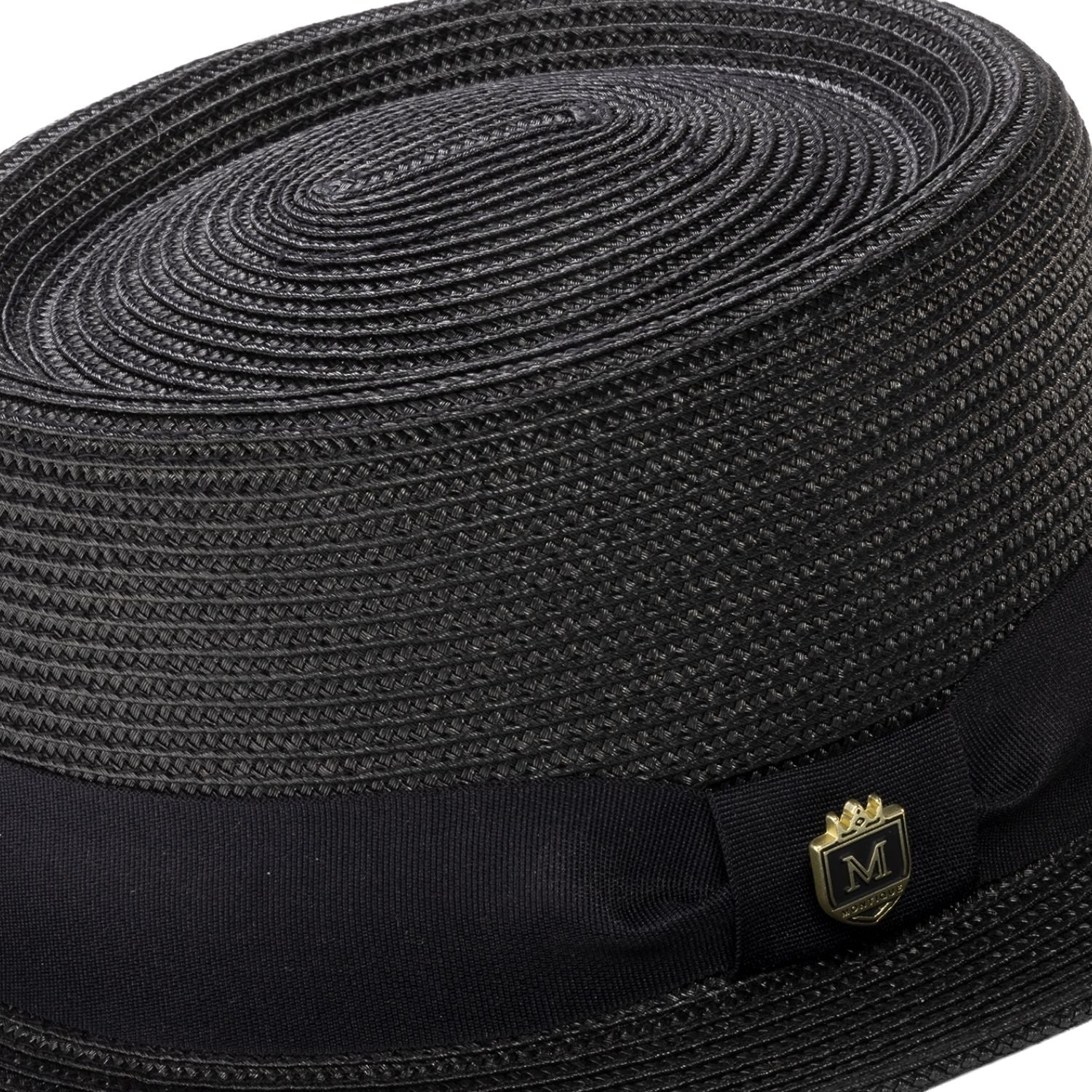 Close-up black hat band and crest pin
